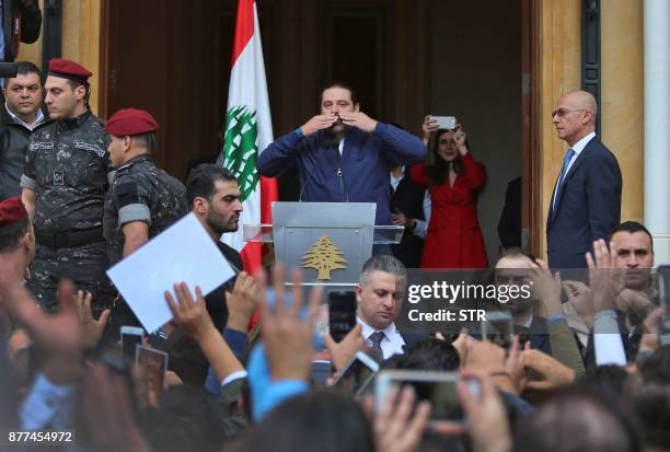 Lebanese prime minister Saad Hariri greets his supporters upon his arrival at his home in Beirut on November 22, 2017. Hariri, back in Beirut after a...