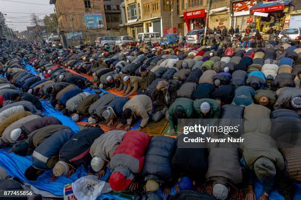 Kashmiri Muslims offer prayers outside the shrine of Khwaja Naqshband on November 22, 2017 in Srinagar, the summer capital of Indian administered...