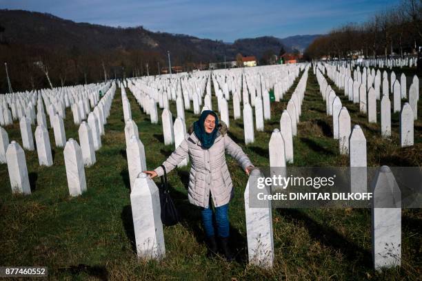 Woman mourns over a relative's grave at the memorial centre of Potocari near Srebrenica on November 22, 2017. United Nations judges on November 22,...