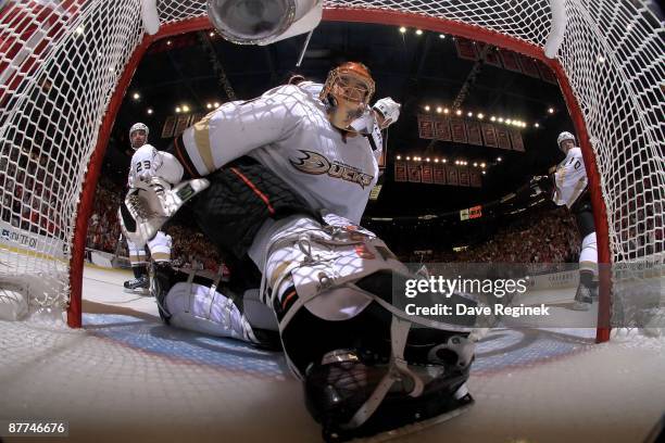 Jonas Hiller of the Anaheim Ducks looks in the net as the puck during Game Seven of the Western Conference Semifinal Round of the 2009 Stanley Cup...