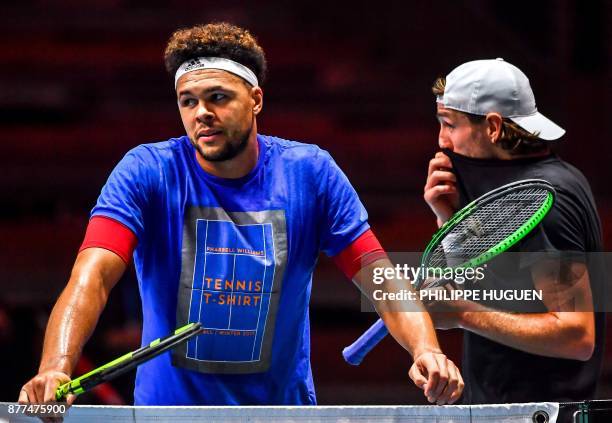 France's tennis players Jo-Wilfried Tsonga and Lucas Pouille attend a training session on November 22, 2017 at the Pierre-Mauroy stadium in...