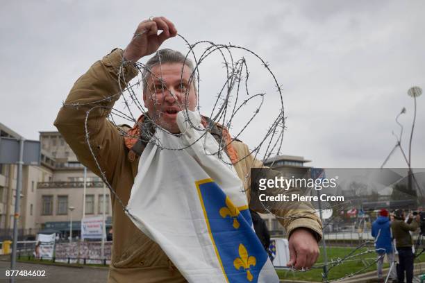 Bosnian Muslim man demonstrates outside the tribunal on November 22, 2017 in The Hague, The Netherlands. The International Criminal Tribunal for the...