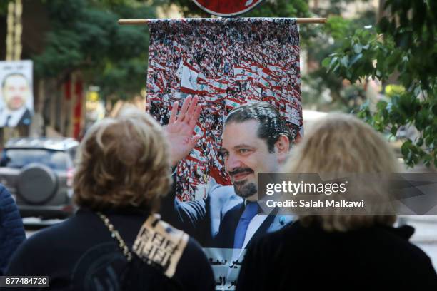 Photo of Lebanon's prime minister Saad Hariri is seen in a street as he makes a public appearance at his home "Beit al-Wasat" November 22, 2017 in...