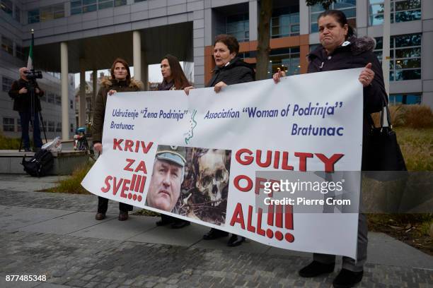 Bosnian Muslim women hold a banner outside the tribunal on November 22, 2017 in The Hague, The Netherlands. The International Criminal Tribunal for...