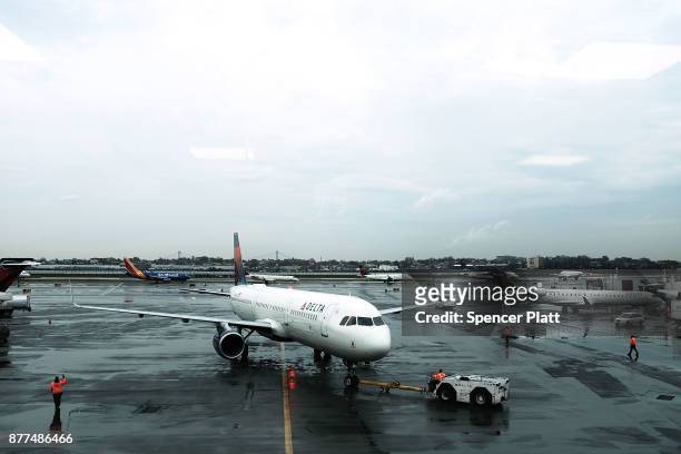 Delta planes sit on the tarmac at LaGuardia Airport on the day before Thanksgiving, the nation's busiest travel day on November 22, 2017 in New York...
