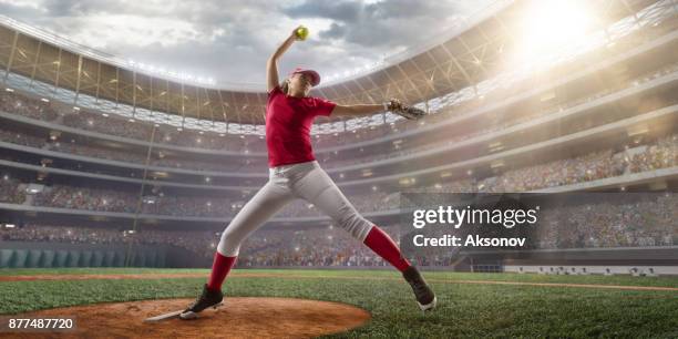 softball female player on a professional arena - softball glove stock pictures, royalty-free photos & images