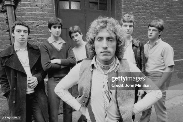 British singer and actor Roger Daltrey of rock group The Who with young actors during shooting of drama film Quadrophenia, UK, 25th October 1978.