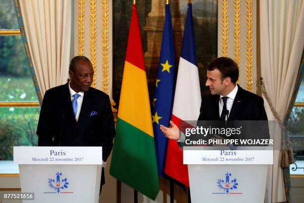 French President Emmanuel Macron and Guinea's President Alpha Conde hold a joint press conference following a meeting at the Elysee Palace in Paris,...