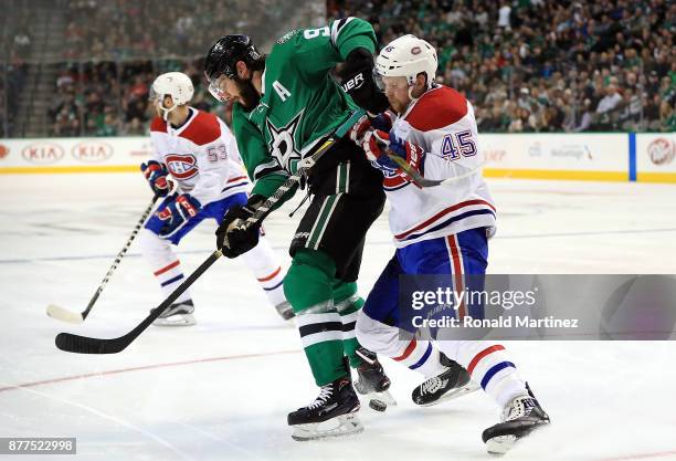 Tyler Seguin of the Dallas Stars skates the puck against Joe Morrow of the Montreal Canadiens in the third period at American Airlines Center on...