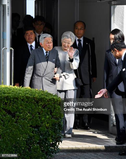 Emperor Akihito and Empress Michiko wave to well-wishers on arrival at Yakushima Airport on November 16, 2017 in Yakushima, Kagoshima, Japan.