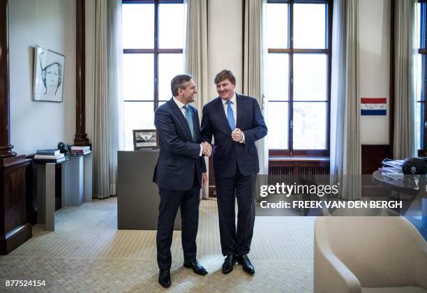 Dutch King Willem-Alexander welcomes CDA party leader Sybrand Buma at the Noordeinde Palace in The Hague, on November 22, 2017. After the...