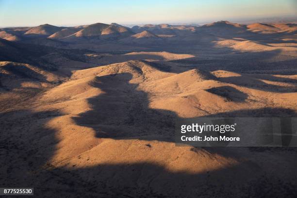 Customs and Border Protection helicopter flies over the Big Bend area on November 22, 2017 near Van Horn, Texas. Federal agents are searching for...