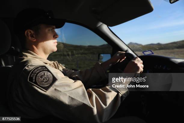 Customs and Border Protection agent drives along Interstate 10 on November 22, 2017 in Van Horn, Texas. Federal agents are searching for suspects in...