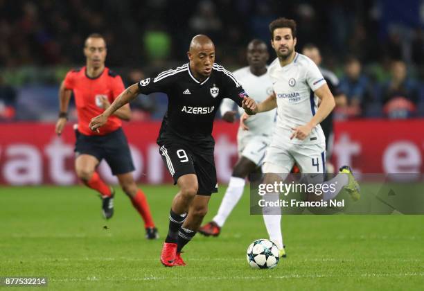 Dino Ndlovu of Qarabag FK and Cesc Fabregas of Chelsea battle for posession during the UEFA Champions League group C match between Qarabag FK and...