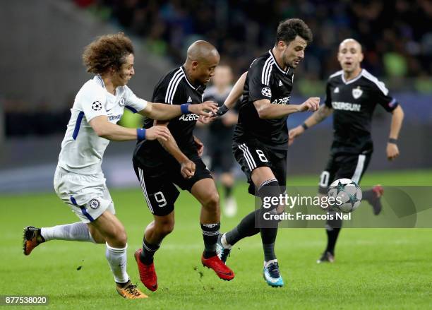 David Luiz of Chelsea , Dino Ndlovu of Qarabag FK and Michel of Qarabag FK battle for possession during the UEFA Champions League group C match...