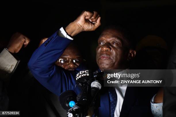 Zimbabwe's incoming president Emmerson Mnangagwa gestures as he speaks at Zimbabwe's ruling Zanu-PF party headquarters in Harare on November 22,...