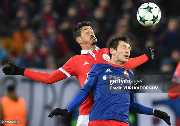 Benfica's defender from Portugal Andre Almeida and CSKA Moscow's midfielder from Russia Alan Dzagoev vie for the ball during the UEFA Champions...