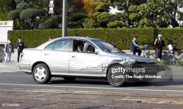 Car flees from police cars at the Ichibancho district on November 13, 2017 in Matsuyama, Ehime, Japan. A 41-year-old "stressed-out" man with his...