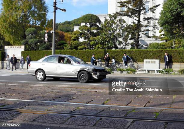 Car flees from police cars at the Ichibancho district on November 13, 2017 in Matsuyama, Ehime, Japan. A 41-year-old "stressed-out" man with his...