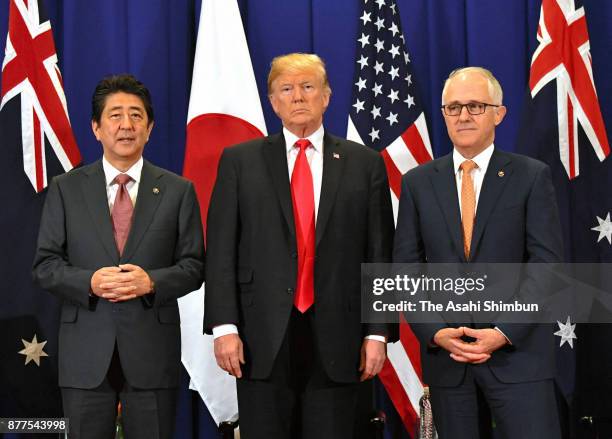 Japanese Prime Minister Shinzo Abe, U.S. President Donald Trump and Australian Prime Minister Malcolm Turnbull attend their trilateral meeting on...