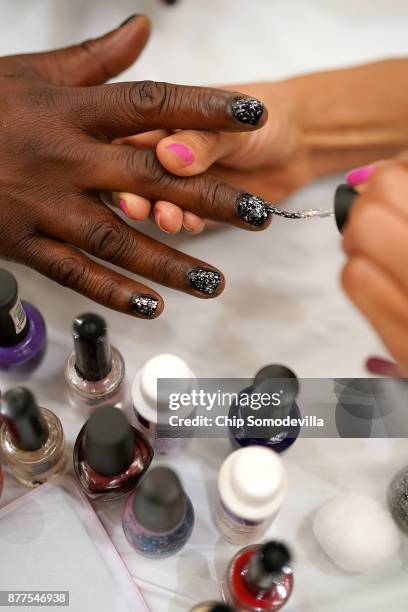 Dozen volunteers from Bennett Career Institute give free manicures during the Salvation Army and Safeway's 18th annual "Feast of Sharing," at the...