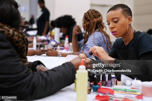 Kashyra Brown and a dozen volunteers from Bennett Career Institute give free manicures during the Salvation Army and Safeway's 18th annual "Feast of...