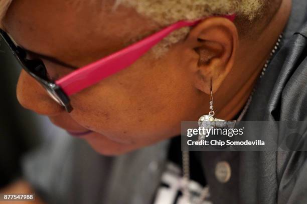 Tammy Johnson, one of a dozen volunteers from Bennett Career Institute, gives manicures during the Salvation Army and Safeway's 18th annual "Feast of...