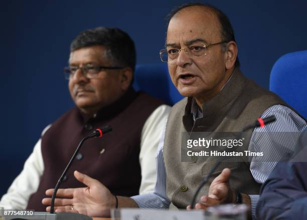 Union Finance Minister Arun Jaitley and Minister of Law and Justice Ravi Shankar Prasad address a press conference briefing after cabinet meeting at...