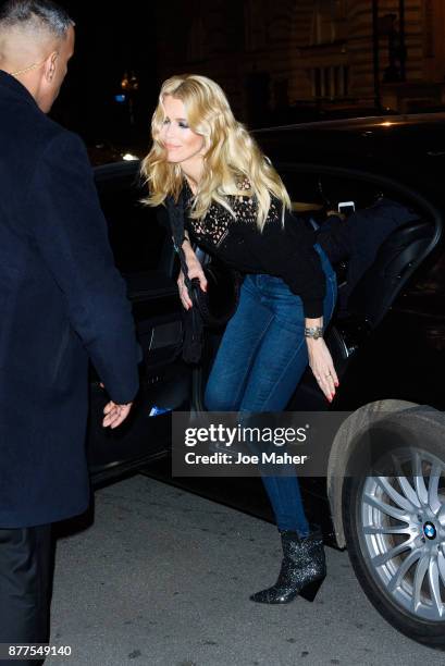 Claudia Schiffer poses at a photocall ahead of meeting fans and signing copies of her new self titled book at The Kingsman Shop on November 22, 2017...