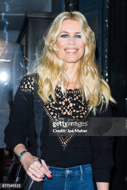 Claudia Schiffer poses at a photocall ahead of meeting fans and signing copies of her new self titled book at The Kingsman Shop on November 22, 2017...