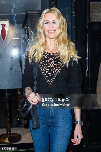 Claudia Schiffer poses at a photocall ahead of meeting fans and signing copies of her new self titled book at The Kingsman Shop on November 22, 2017...