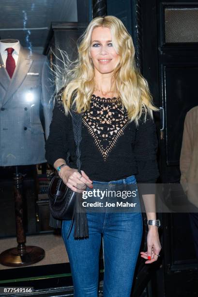 Claudia Schiffer poses at a photocall ahead of meeting fans and signing copies of her new self titled book at The Kingsman Shop on November 22, 2017...