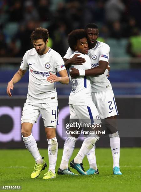 Willian of Chelsea celebrates after scoring with Antonio Rudiger of Chelsea and Cesc Fabregas of Chelsea during the UEFA Champions League group C...