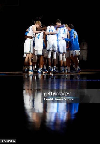 The UCLA Bruins huddle prior to the National Collegiate Basketball Hall Of Fame Classic consolation game against the Wisconsin Badgers at Sprint...