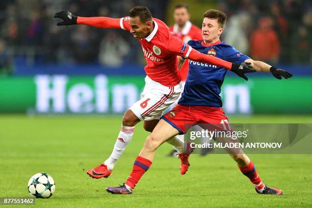 Benfica's midfielder from Brazil Filipe Augusto and CSKA Moscow's midfielder from Russia Aleksandr Golovin vie for the ball during the UEFA Champions...