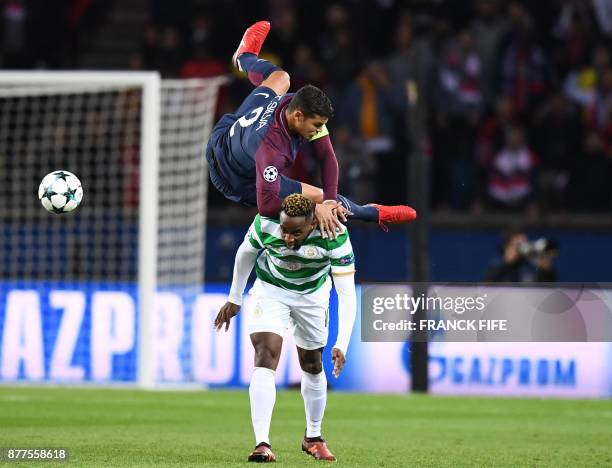 Paris Saint-Germain's Brazilian defender Thiago Silva fights for the ball with Celtic's French striker Moussa Dembele during the UEFA Champions...