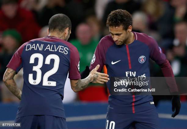 Neymar of PSG celebrates scoring his team's first goal with Dani Alves during the UEFA Champions League group B match between Paris Saint-Germain and...