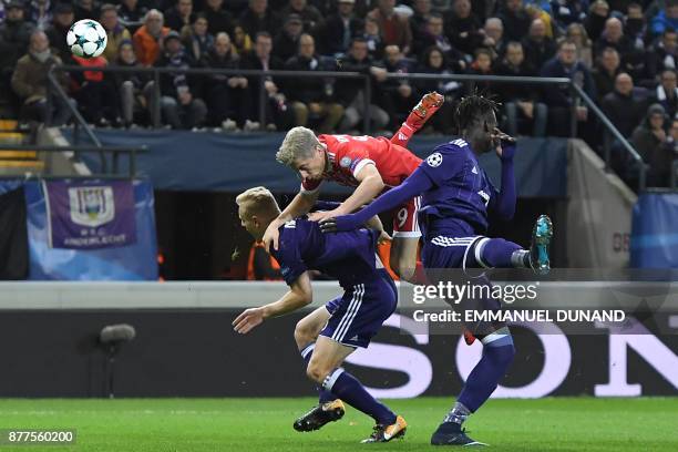 Bayern Munich's Polish forward Robert Lewandowski vies with Anderlecht's Senegalese defender Serigne Mbodji during the UEFA Champions League Group B...