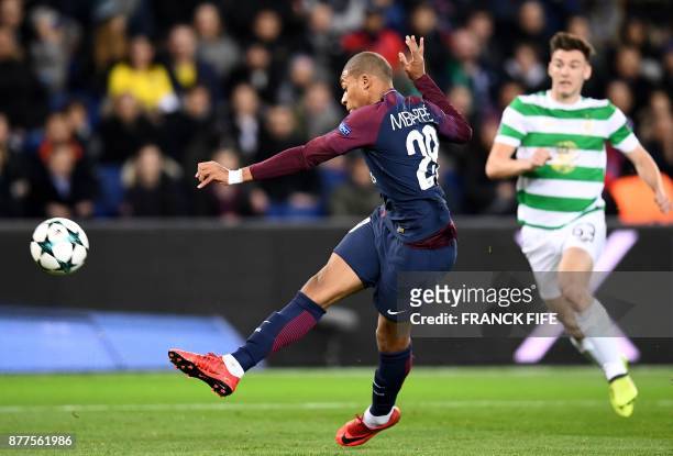 Paris Saint-Germain's French striker Kylian Mbappe kicks the ball during the UEFA Champions League Group B football match between Paris Saint-Germain...