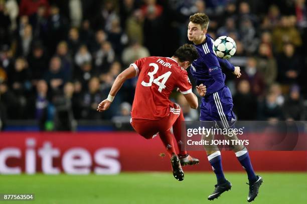 Bayern Munich's Austrian defender Marco Friedl vies with Anderlecht's Belgian midfielder Pieter Gerkens during the UEFA Champions League Group B...