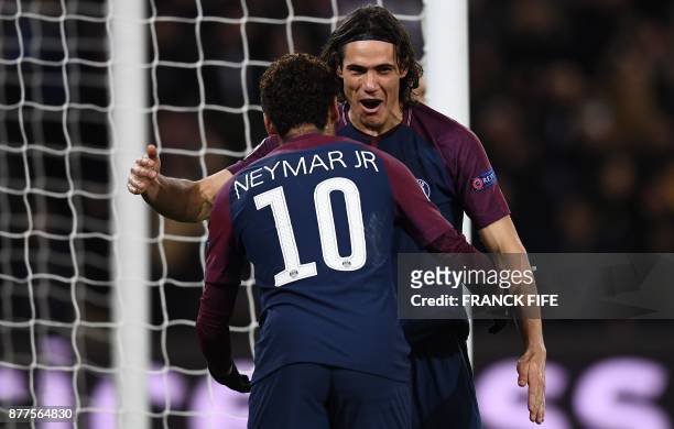 Paris Saint-Germain's Uruguayan striker Edinson Cavani celebrates with teammate Brazilian striker Neymar after scoring his team's third goal during...