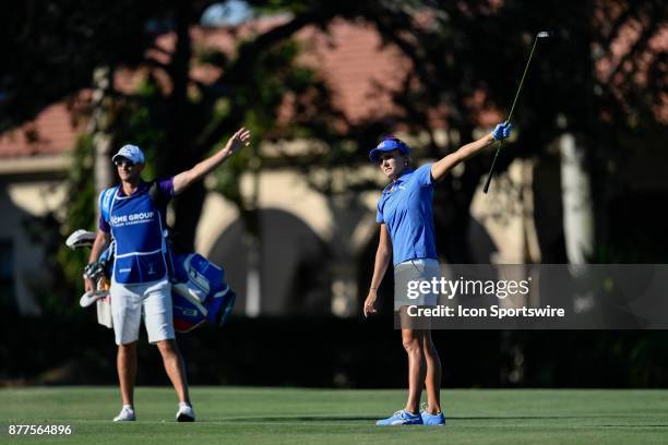 Lexi Thompson of the United States and her caddie, Kevin McAlpine, signal that her approach shot is wide left on the seventeenth hole during the...