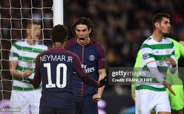 Paris Saint-Germain's Uruguayan striker Edinson Cavani celebrates with teammate Brazilian striker Neymar after scoring his team's third goal during...