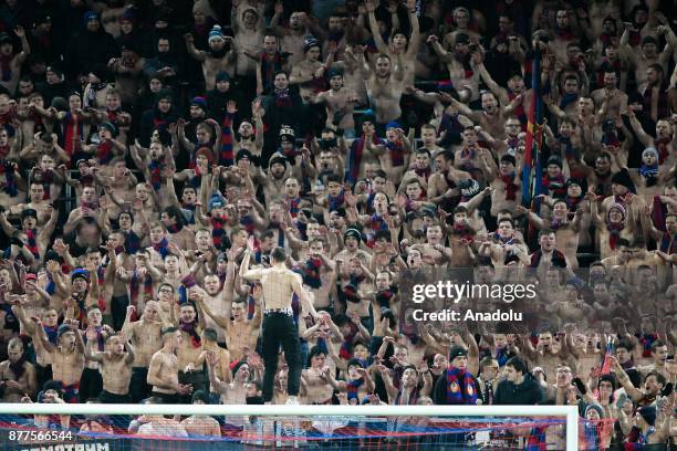 Fans of CSKA Moscow support their team during the UEFA Champions League Group A soccer match between CSKA Moscow and Benfica at VEB Arena in Moscow,...