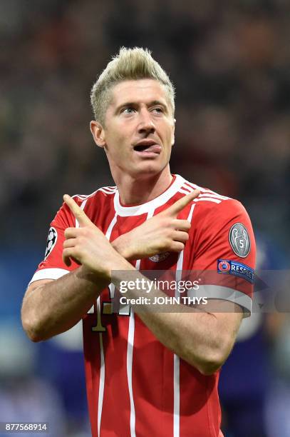 Bayern Munich's Polish forward Robert Lewandowski celebrates after scoring a goal during the UEFA Champions League Group B football match between...