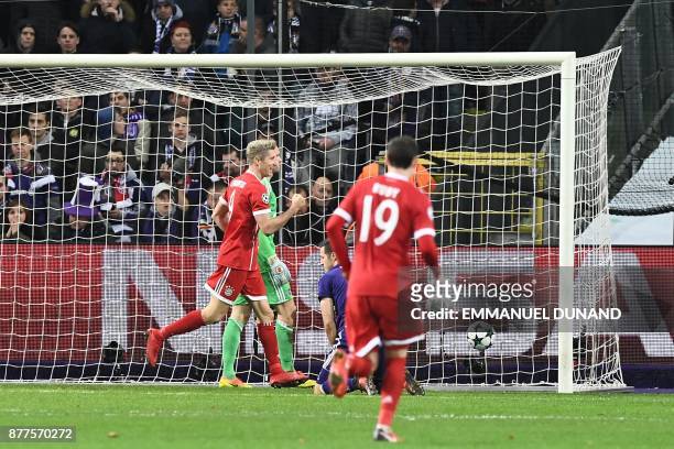 Bayern Munich's Polish forward Robert Lewandowski celebrates after scoring a goal during the UEFA Champions League Group B football match between...