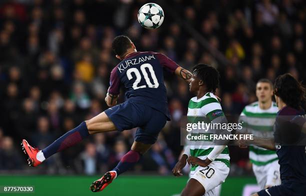 Celtic's Belgian defender Dedryck Boyata fights for the ball with Paris Saint-Germain's French defender Layvin Kurzawa during the UEFA Champions...