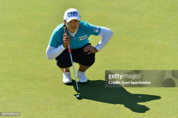 Amy Yang of the United States lines up her putt on the thirteenth hole during the final round of the LPGA CME Group Championship at Tiburon Golf Club...