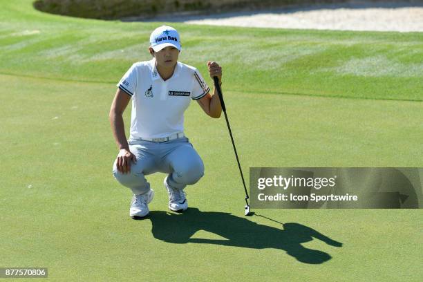 Sung Hyun Park of South Korea lines up her putt on the thirteenth hole during the final round of the LPGA CME Group Championship at Tiburon Golf Club...