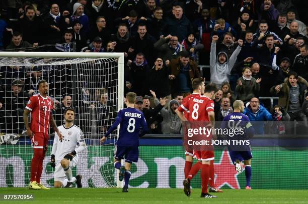 Bayern Munich's players react after Anderlecht's Algerian midfielder Sofiane Hanni scored a goal during the UEFA Champions League Group B football...